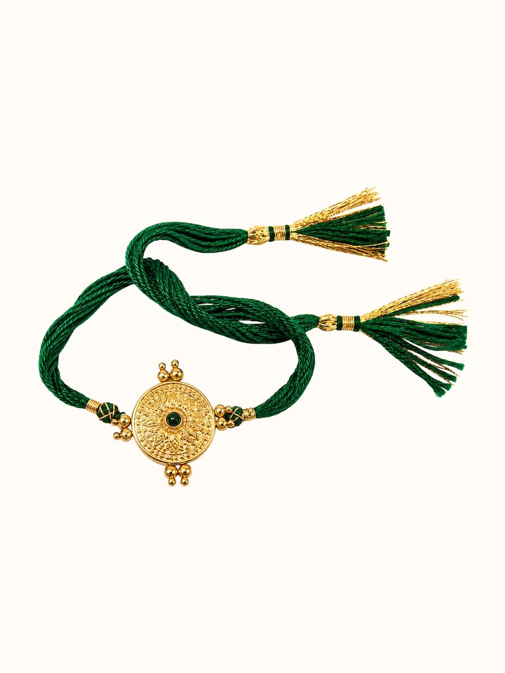 Front view of Silversmithing Rakhi showing the complete piece and design