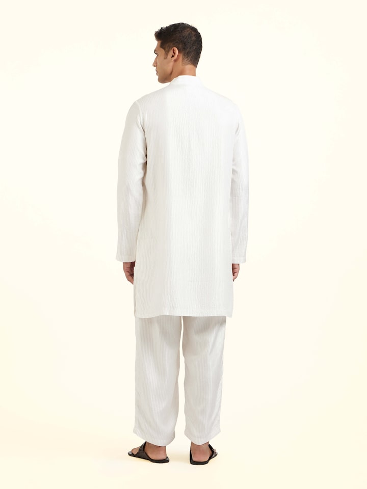 Back view of white silk quilting short kurta displaying clean structured design