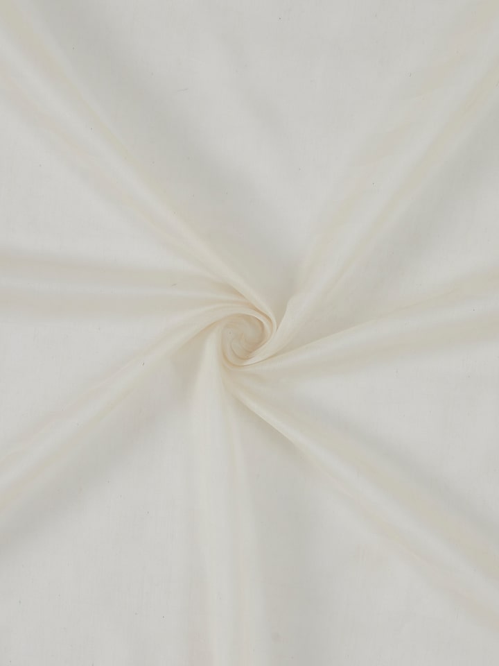 Angled shot of ivory sheer curtain with bold handwoven stripes in Maheshwari weave.