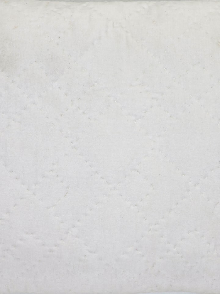Detail of stitching and texture on Shivranjini beige lumbar cushion cover