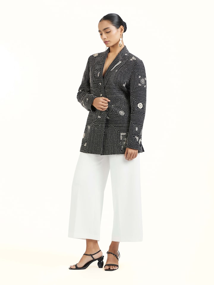 Side view of black silk kantha jacket showcasing tailored fit