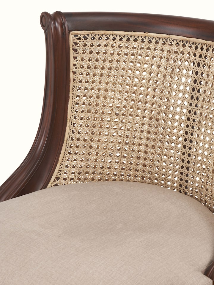 Close-up view of upholstered Mahogany wood study chair showing textured fabric and smooth finish