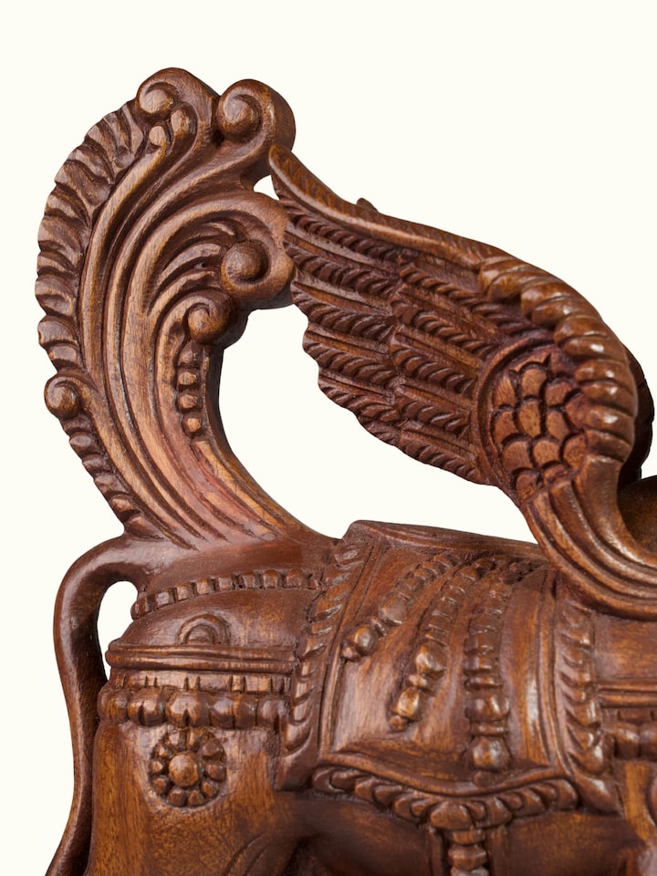 Detailed view of the Wood Carved Kamadhenu Idol