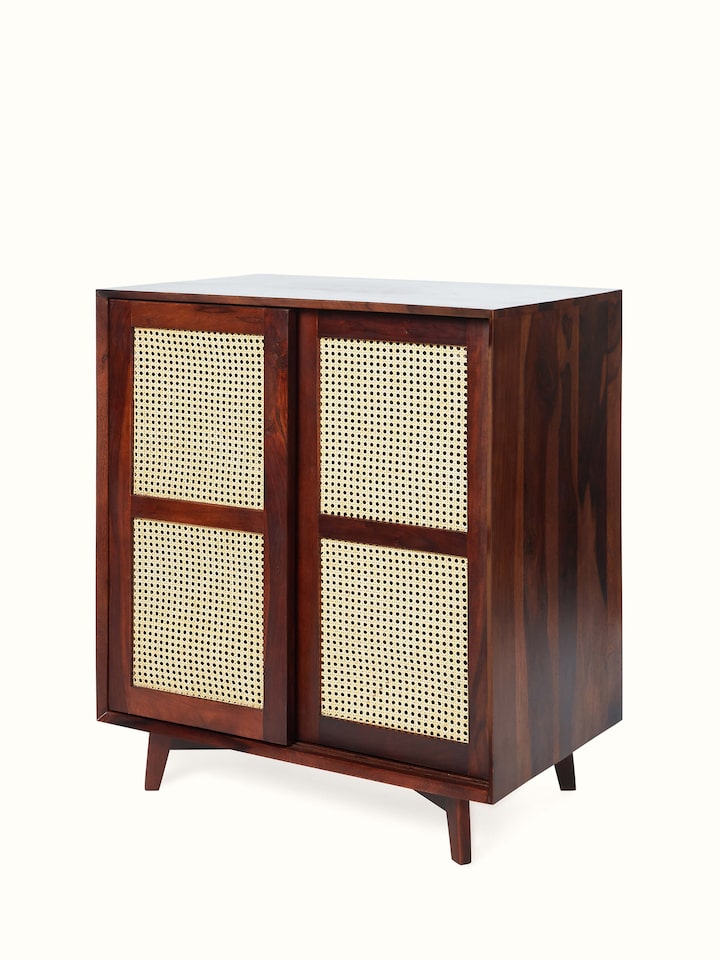 Close-up of the Sheesham wood and cane bar cabinet, highlighting the intricate cane work and wood finish.