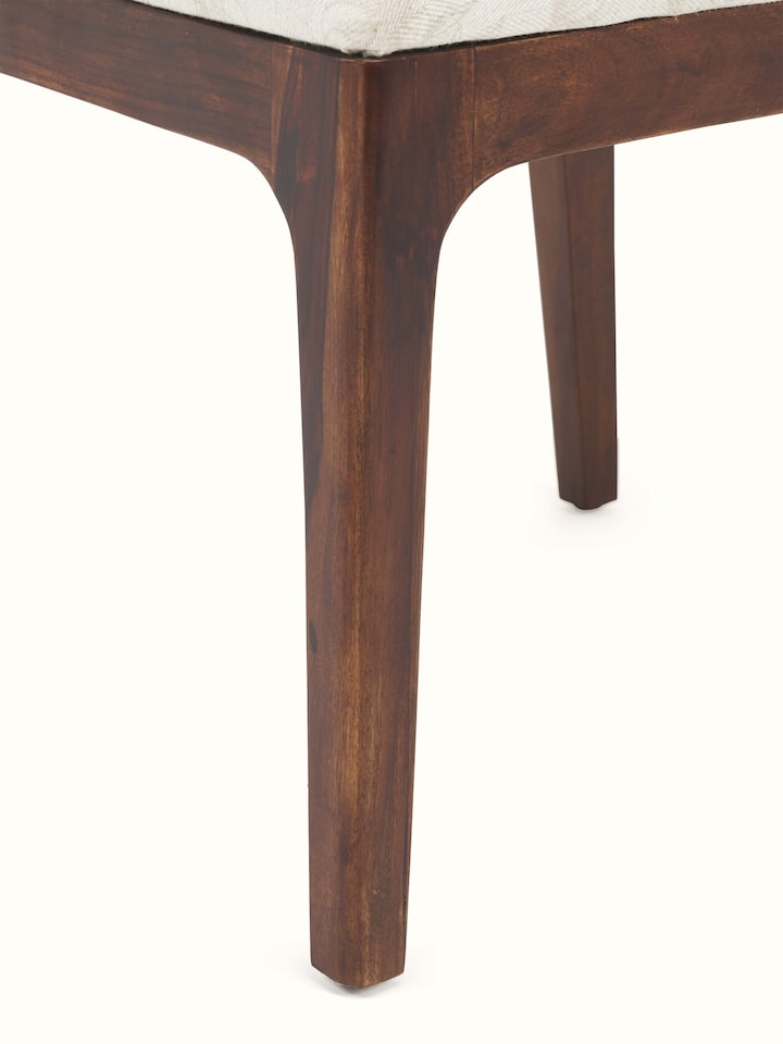 Close-up of Sheesham Wood & Cane Dining Chair highlighting the comfortable seat and rich sheesham wood finish.