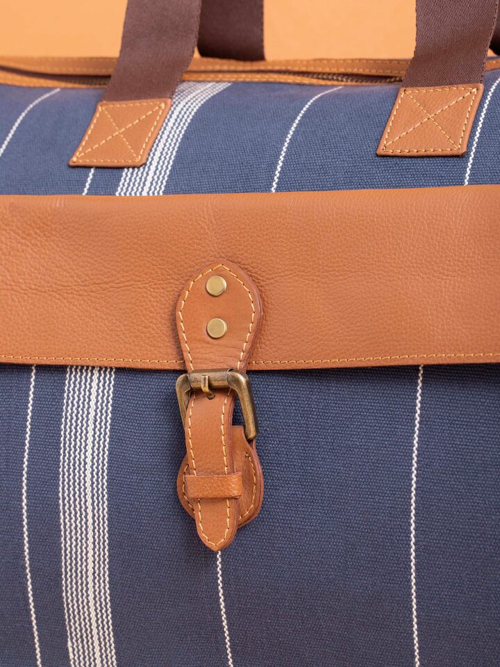 Side view of Blue Handloom Cotton Duffle Bag focusing on the intricate patterns and craftsmanship