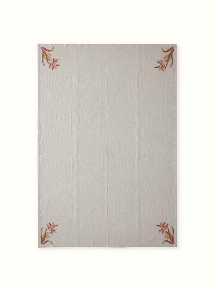 Front view capturing the soft beige tone and handcrafted embellishments