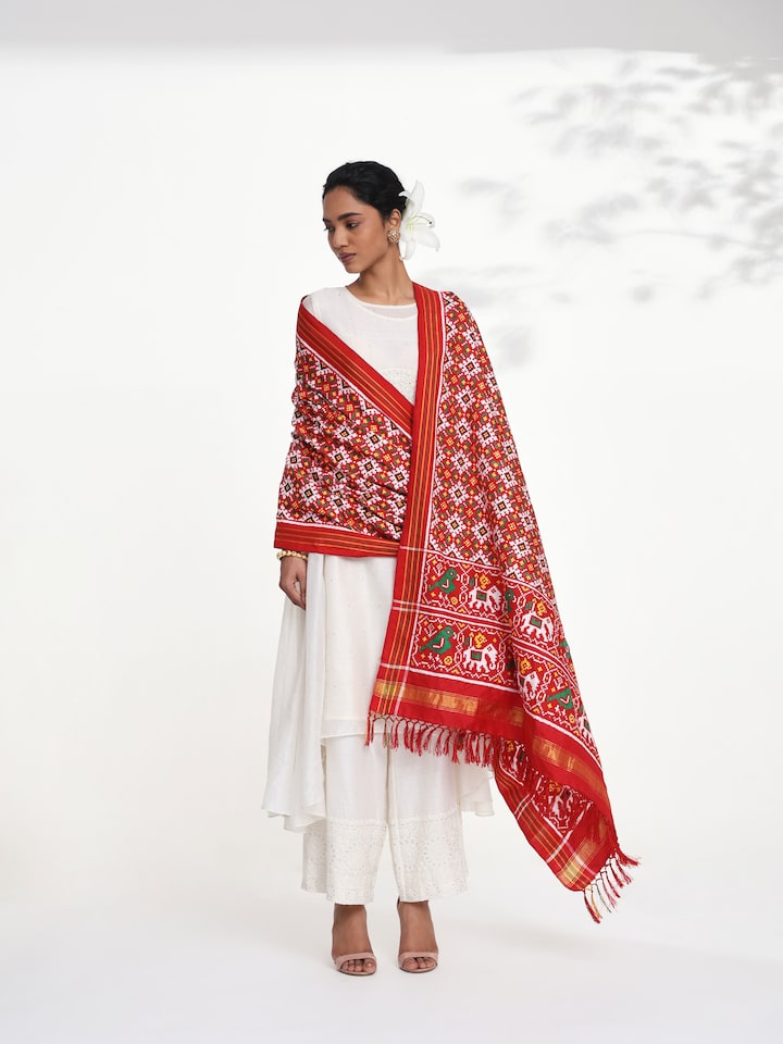 Side view of pink ikat Patan Patola handwoven dupatta highlighting elegant drape
