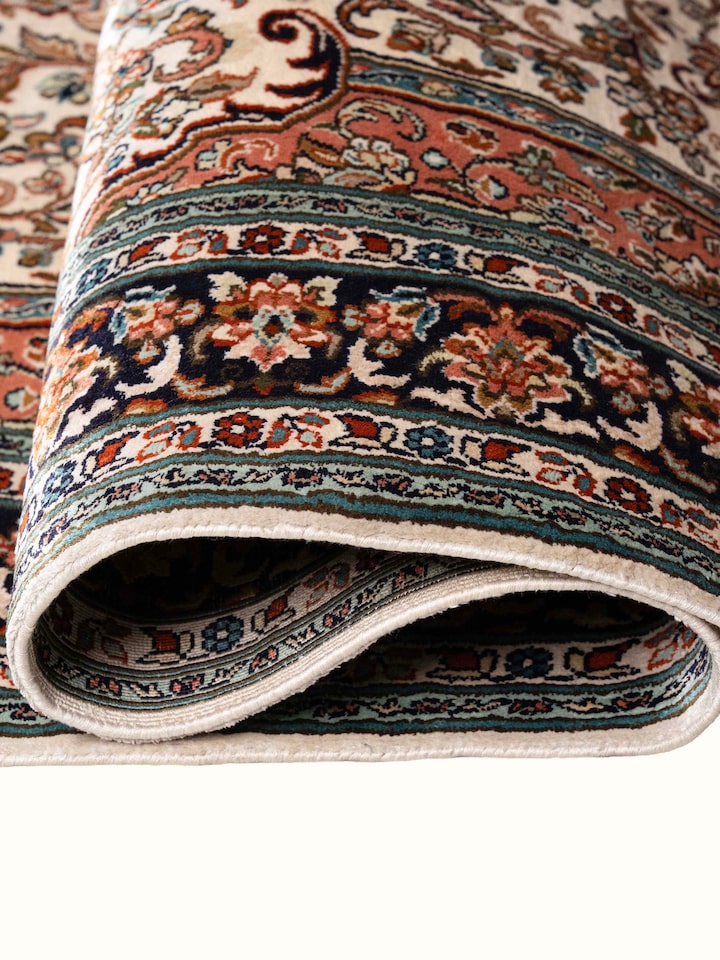 Detail view of Traditional Persian Ivory Rust Kashan Kashmir Silk Hand-Knotted Carpet highlighting the intricate pattern and pile texture, from a d...