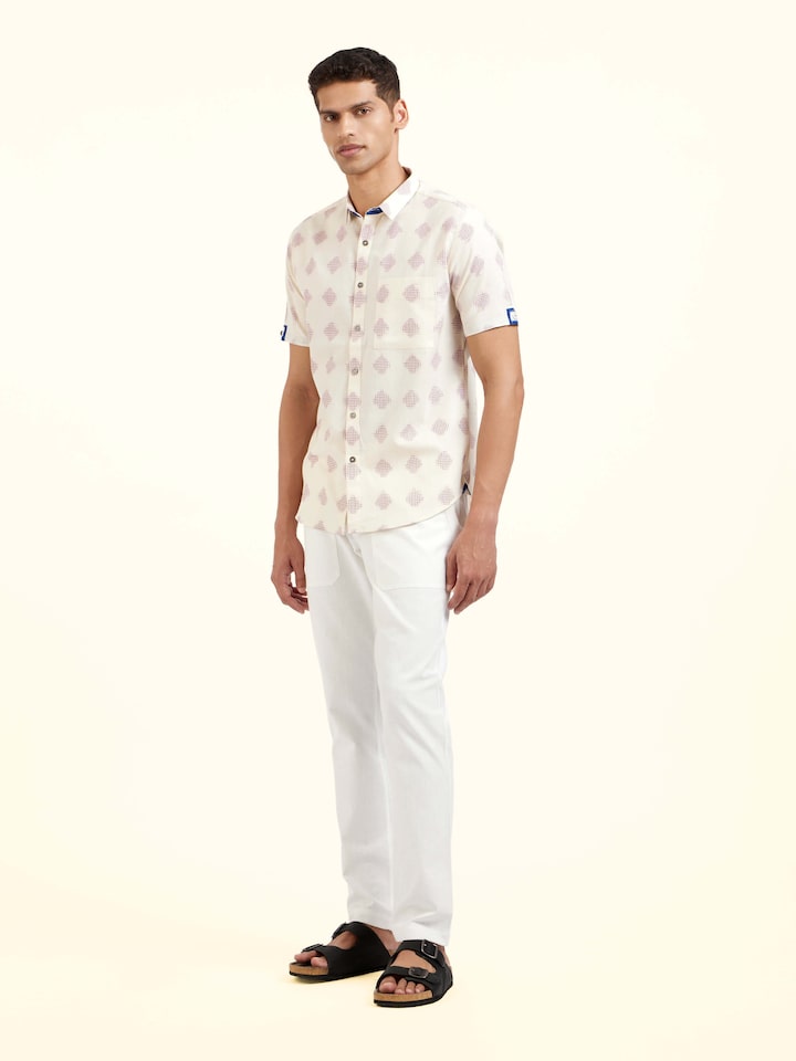 Side view of white cotton Telangana Ikat shirt highlighting tailored silhouette