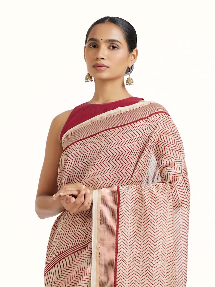 Angled view of Red Chanderi Cotton Silk Bagh Block Printed Saree revealing the depth of its color and intricate pattern