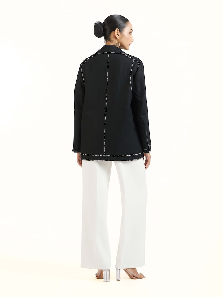 Back view of black wool kantha jacket with all-over kantha stitching pattern
