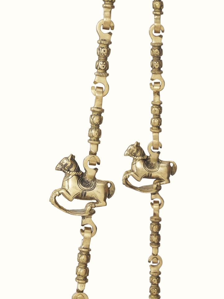 Full view of the carved Sheesham wood and brass swing, arranged to display its overall design and ornate details.