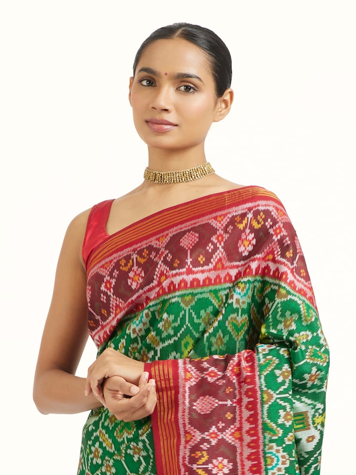 Angled view of Rajkot Semi Patola Saree revealing the depth of its color and intricate pattern
