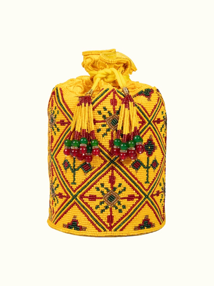 Close-up view of Beadwork Yellow Potli Bag highlighting the fabric weave and craftsmanship
