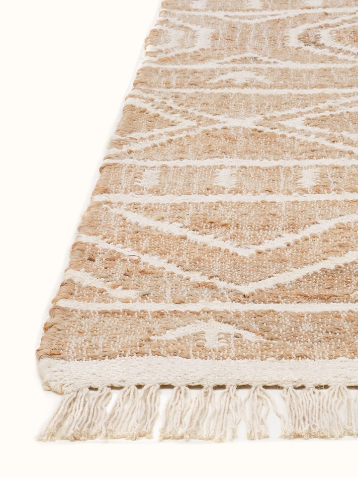 Close-up of Graphic Geo Beige Jute Natural Fibre Rug focusing on the intricate geometric design and texture.