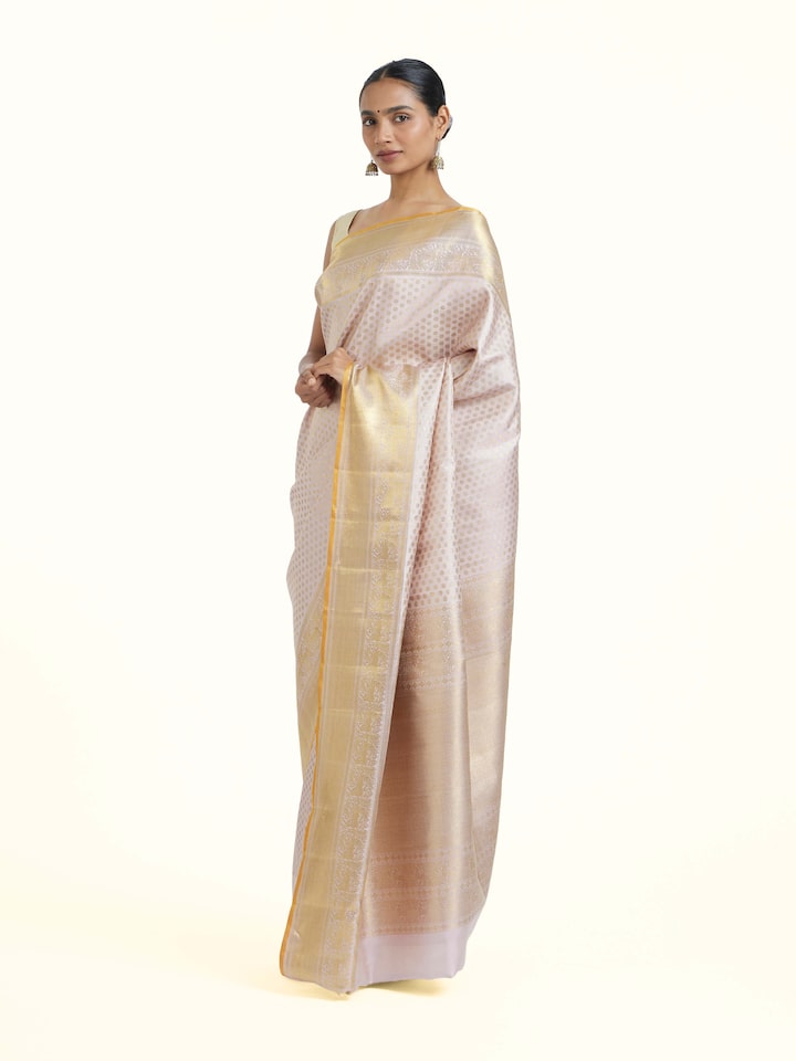 Side view of Light Pink Kancheepuram Silk Zari Saree highlighting the detailed craftsmanship and elegant silhouette