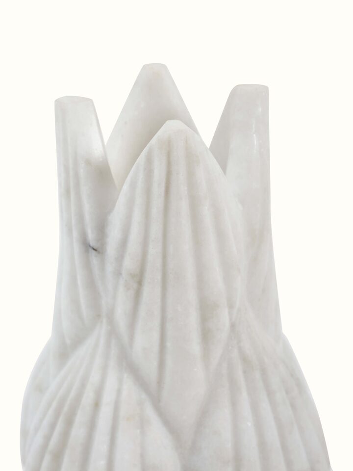 Close-up detail of marble floor vase craftsmanship