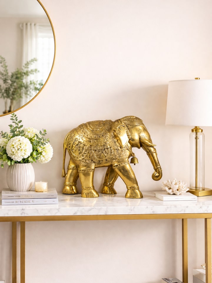 lifestyle view of brass airavat elephant figurine with intricate detailing