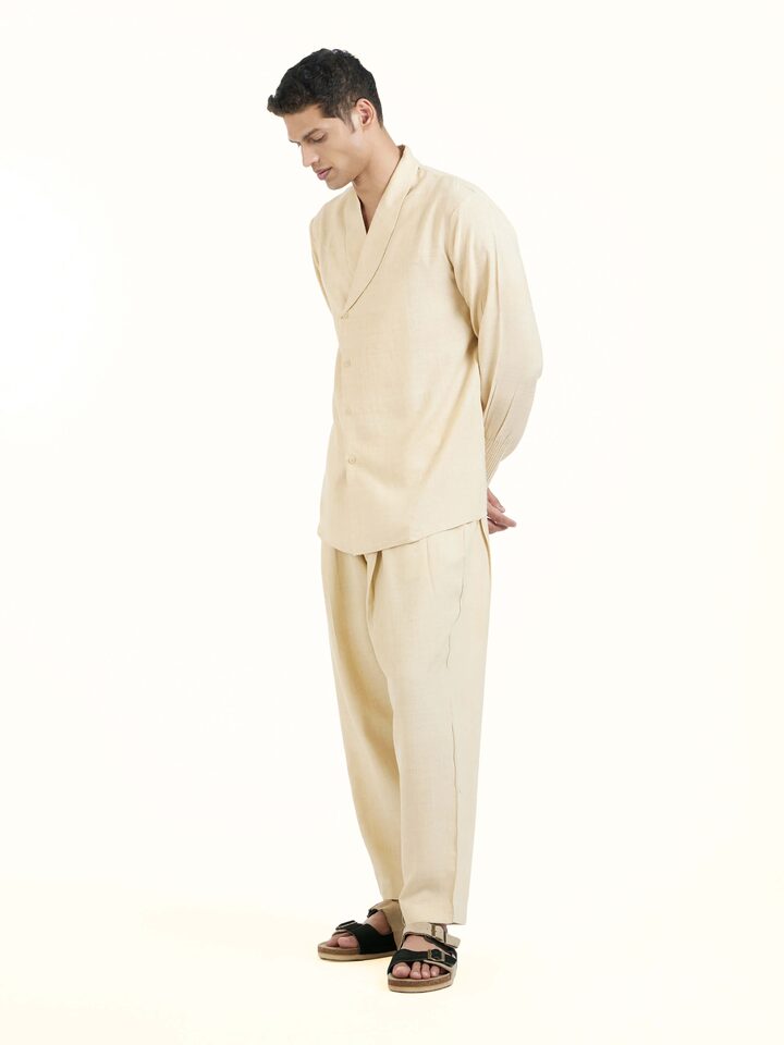 Side view of beige silk handloom jacket highlighting tailored fit