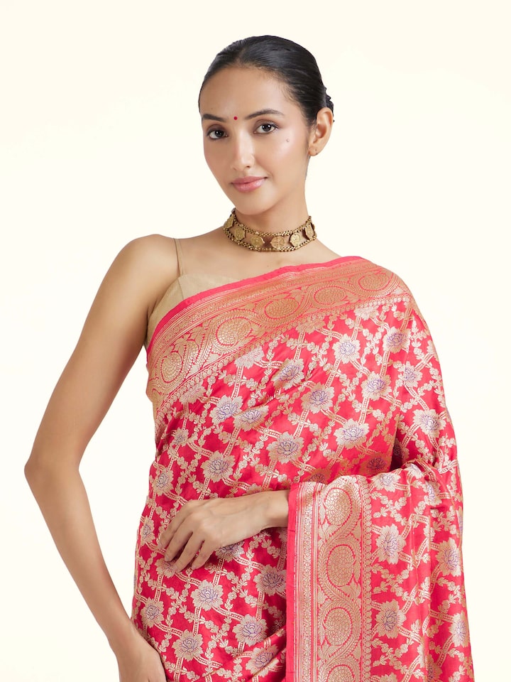 Angled view of red mulberry katan silk Banarasi saree showcasing traditional design