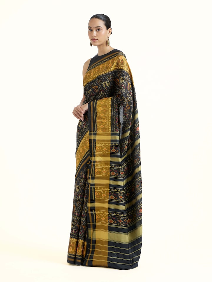 Side view of Rajkot Patola Ikat Saree highlighting the detailed craftsmanship and elegant silhouette
