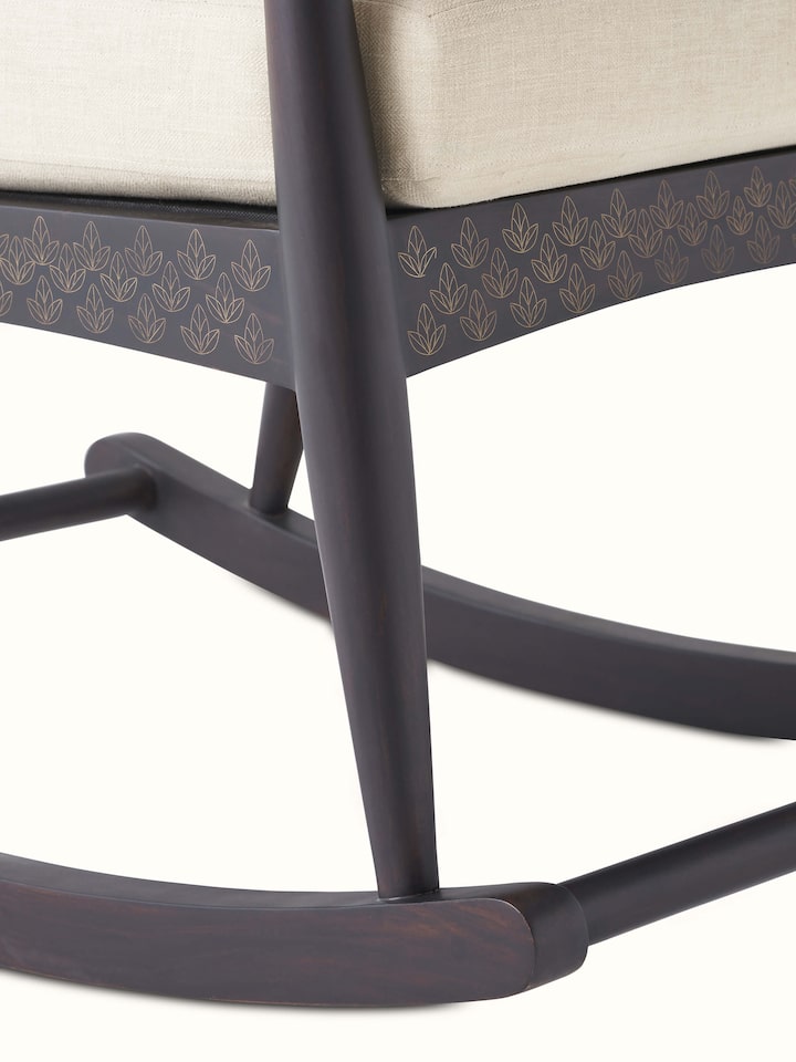 Sheesham wood and brass tarkashi rocking chair with visible craftsmanship, highlighting the elegant and traditional design elements.