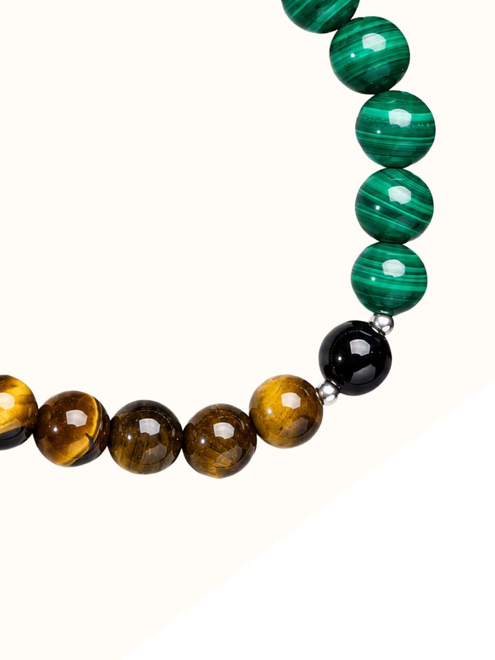 Detail view of Gemstone Tiger Eye, Black Onyx & Malachite Bead Silver Bracelet highlighting the stone setting and metalwork detail