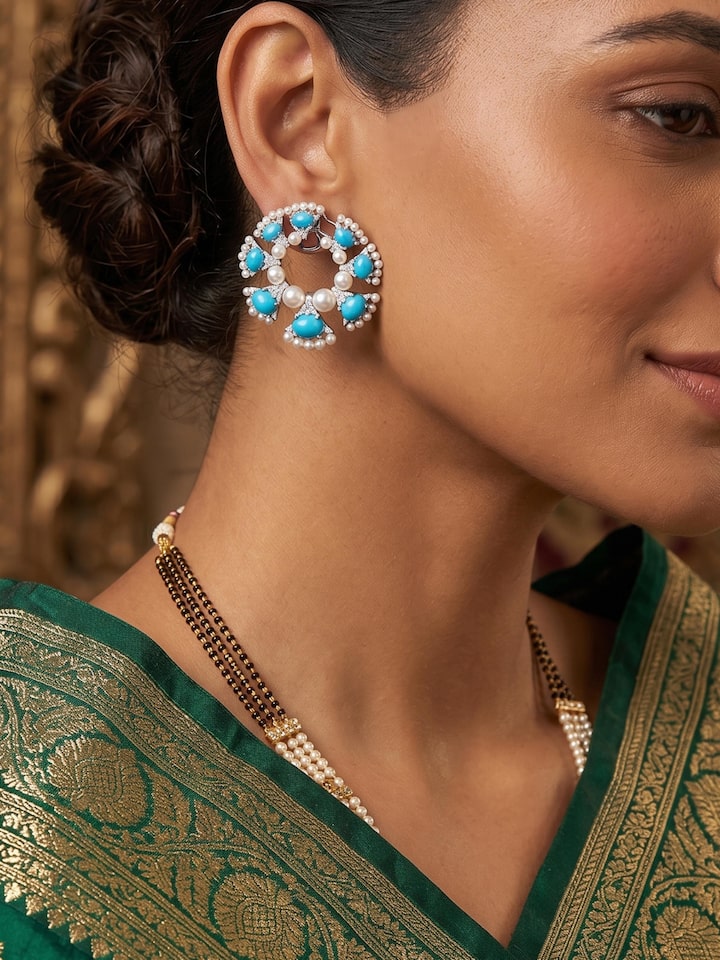 Styled view of Silver Smithing Stud Earrings worn on the ear, showing how it looks styled