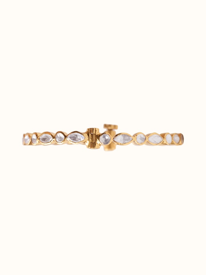 close-up view of silver smithing gold plated bangle texture