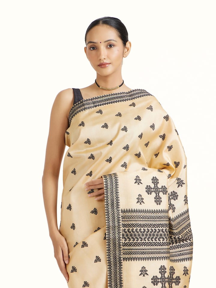 Angled view of Beige Tussar Silk Saree revealing the depth of its color and intricate pattern