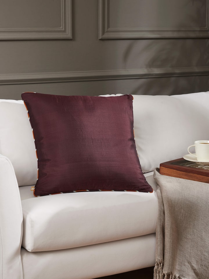 Lifestyle setting featuring handloom Ikat cushion in a cozy room arrangement.