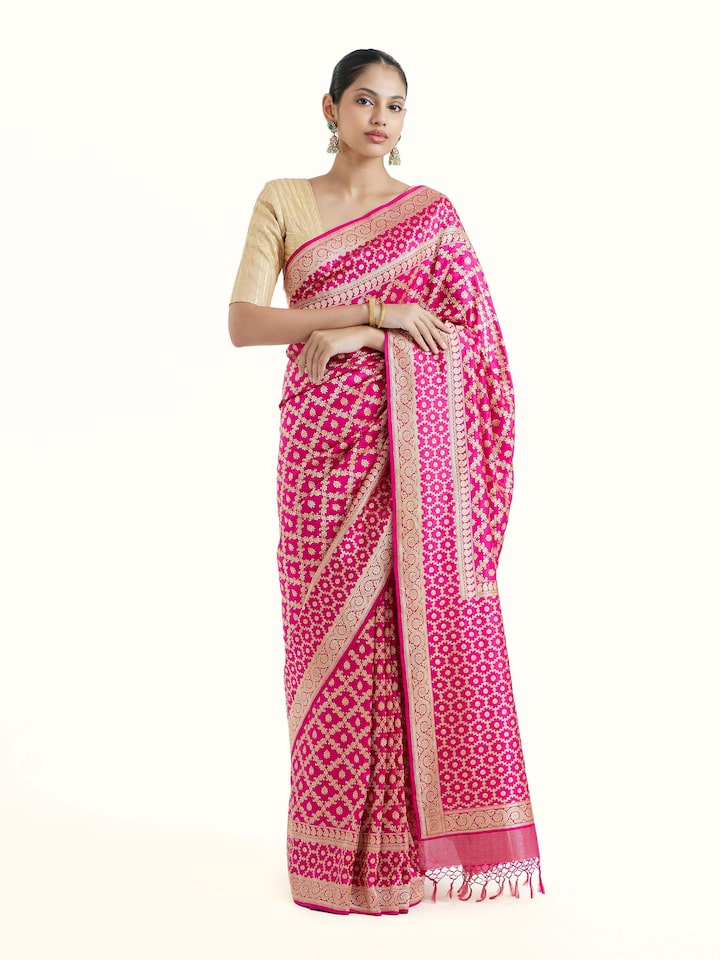 Front view of fuschia katan silk Banarasi saree with rich brocade motifs