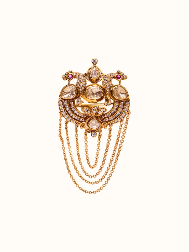 front view of silver smithing brooch pin with intricate design