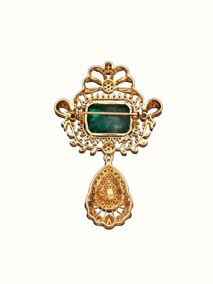 back view of silver smithing yellow gold brooch pin with pin clasp