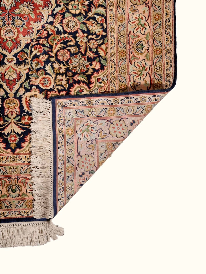 Back view of Traditional Persian Navy Kashan Kashmir Silk Hand-Knotted Carpet showing the reverse weave