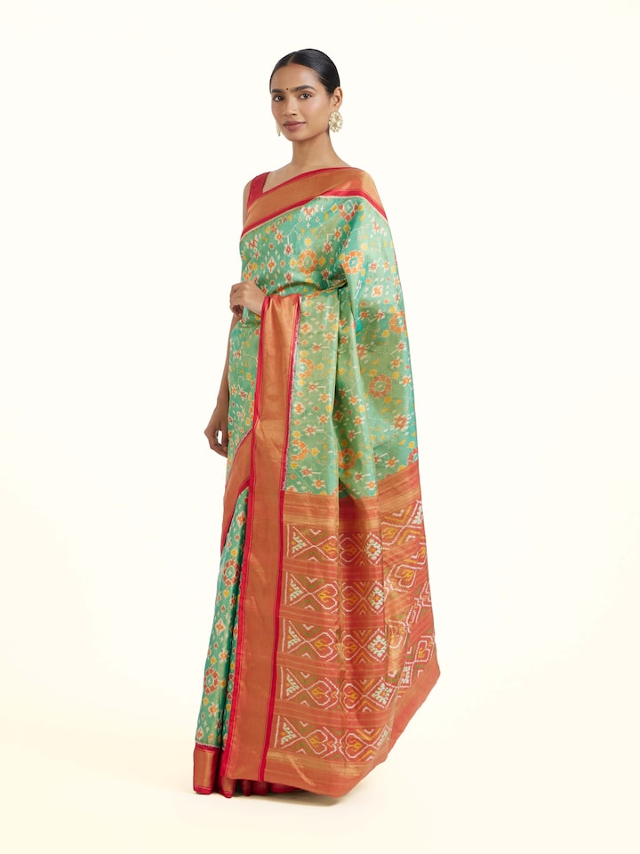 Side view of Brown Pochampally Ikat Silk Saree highlighting the detailed craftsmanship and elegant silhouette