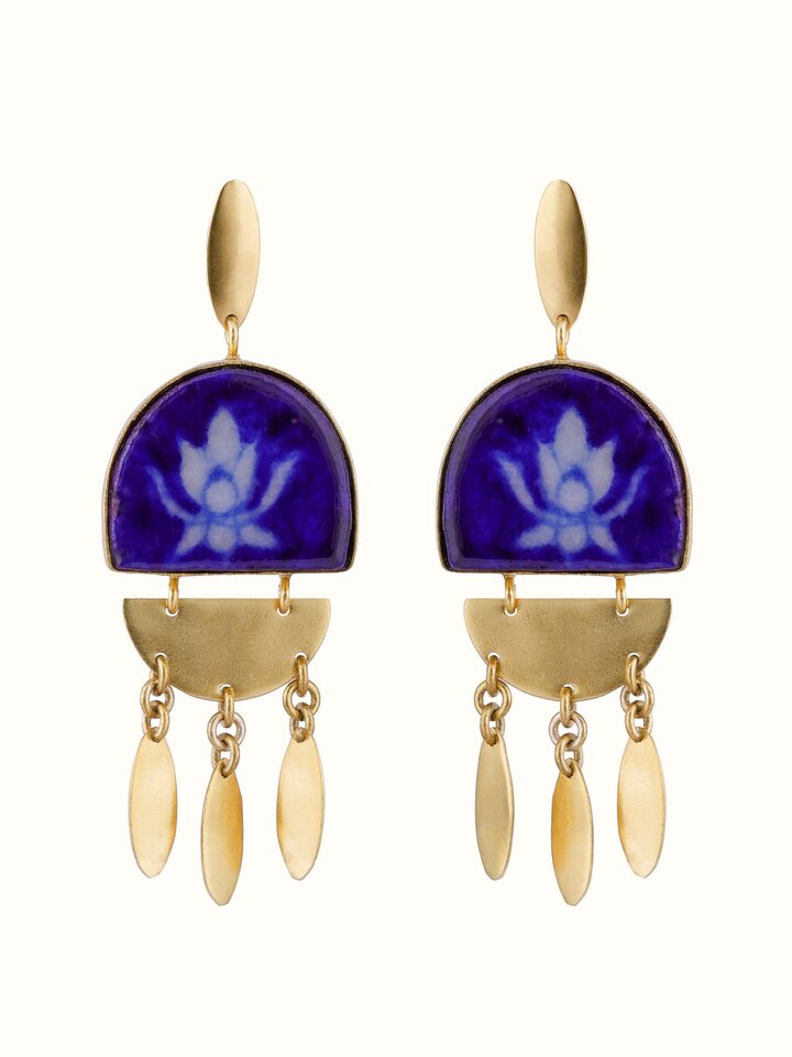 Front view of blue pottery drop earrings featuring traditional blue and white patterns