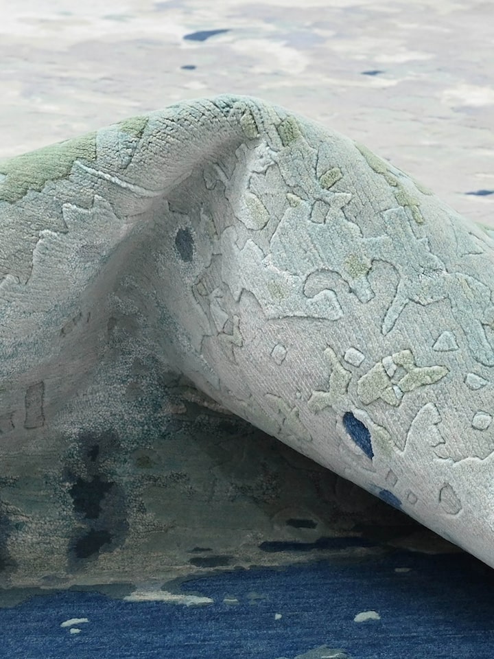 Detail view of Abstract Blue Grey Bhadohi Wool & Bamboo Silk Hand Knotted Rug highlighting the intricate pattern and pile texture, from a different...