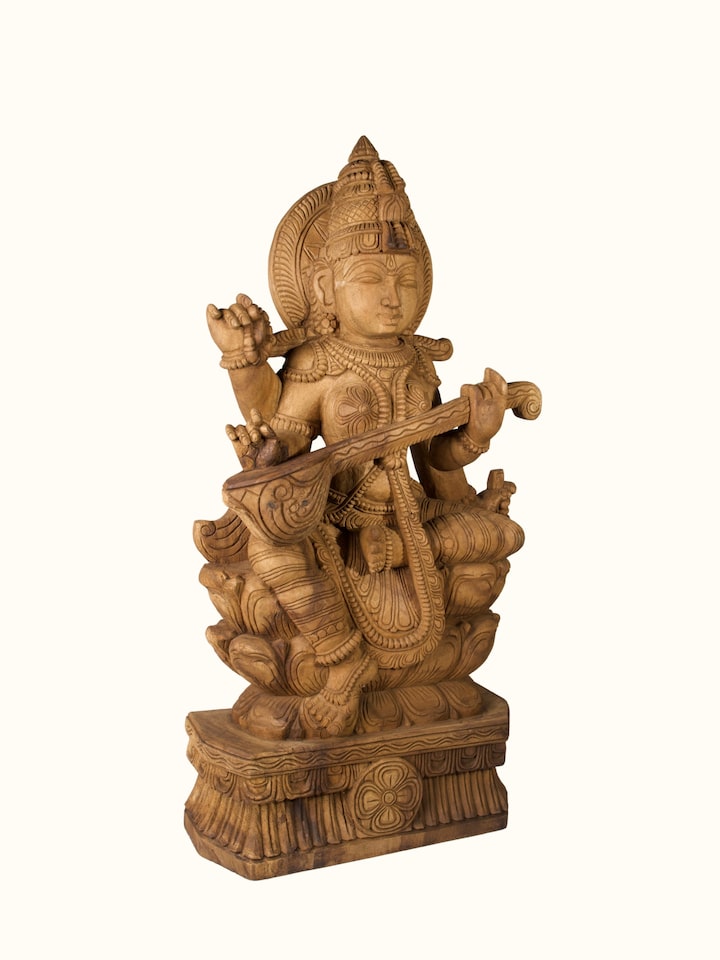 Angled view of the Wood Carved Saraswati Idol