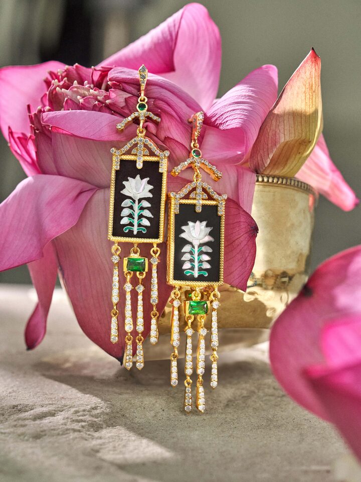 Styled detail view of Parchinkari Silver Drop Earrings worn on the ear, shown in an alternate styled shot