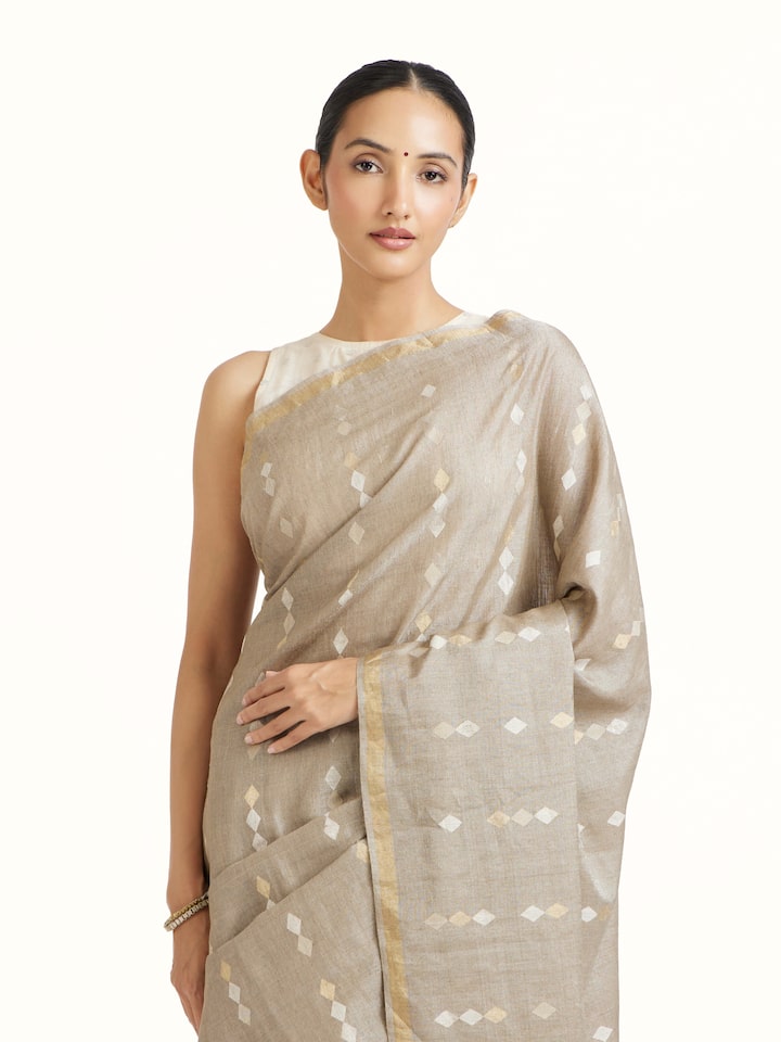 Angled view of Light Grey Tussar Silk Saree revealing the depth of its color and intricate pattern