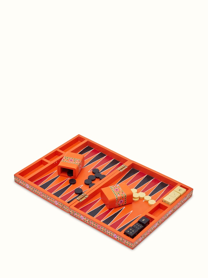 Side view of Ganjifa cedar wood backgammon in orange showing the intricate design and fine woodwork