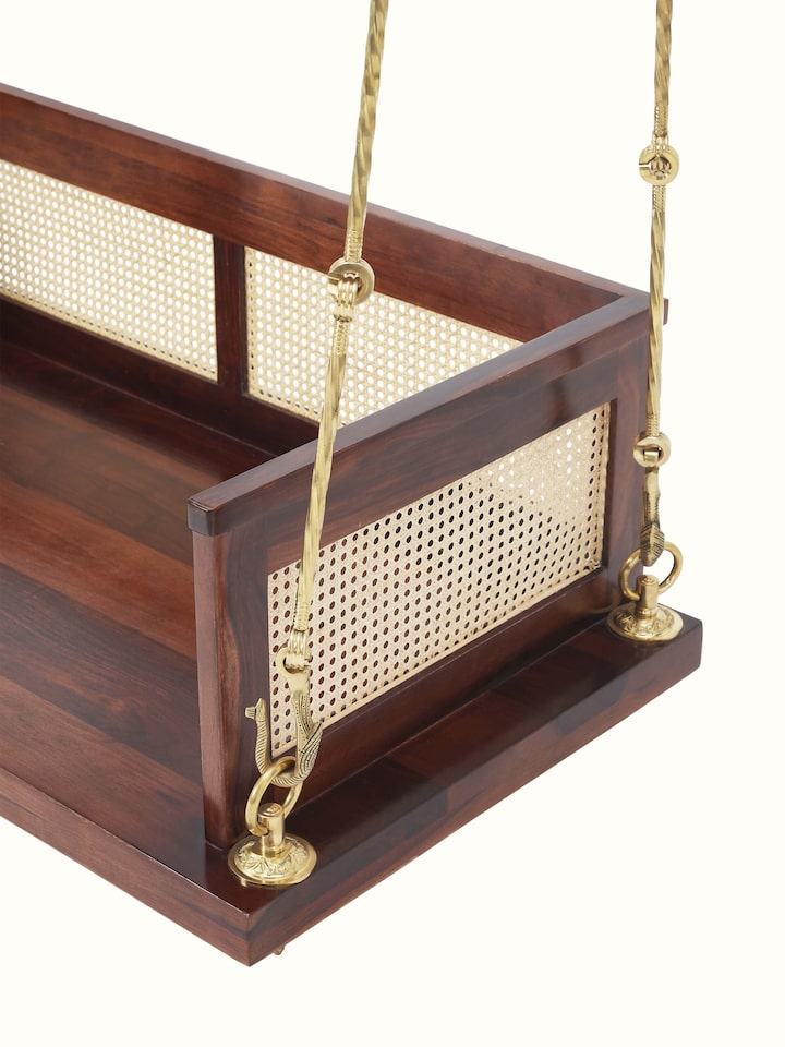 Top view of the Sheesham wood and cane swing, showcasing the seating area and sturdy wooden frame
