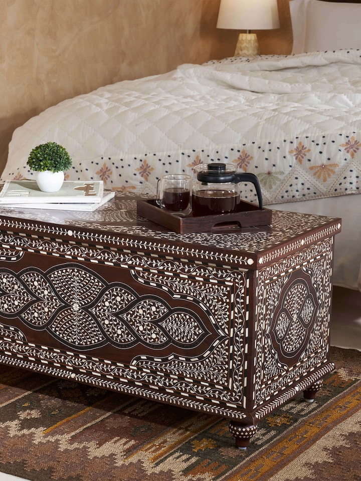 Side view of Sheesham Wood Bone Inlay Turned Leg Trunk displaying elegant bone inlay details and traditional turned wood legs.