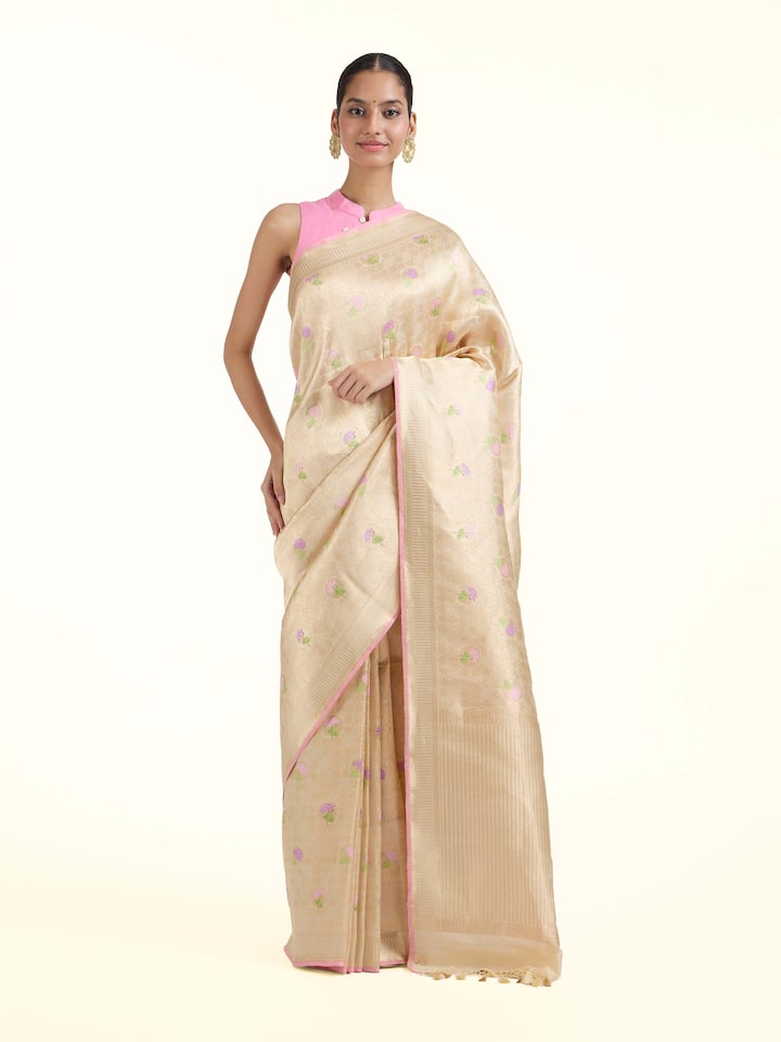 Front view of Off-white Banarasi Brocade Silk Saree showcasing its traditional craftsmanship and design