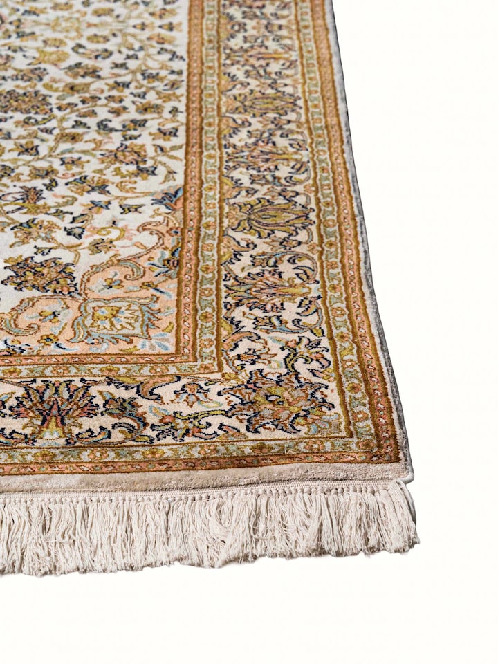 Close-up view of Traditional Persian Ivory Kashan Kashmir Silk Hand-Knotted Carpet highlighting the hand-knotted weave and motif detail