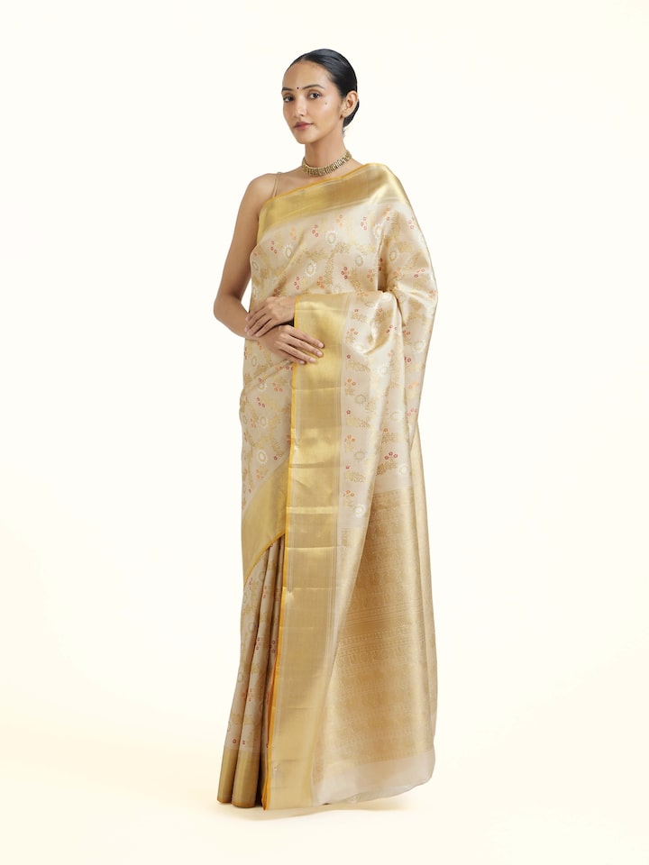 Side view of Beige Kancheepuram Silk Zari Saree highlighting the detailed craftsmanship and elegant silhouette