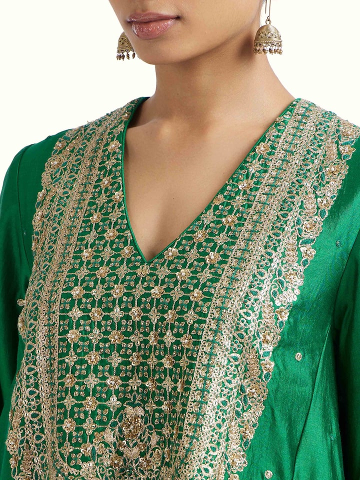 Detail view of emerald green silk hand embroidery kurta set showing silk texture