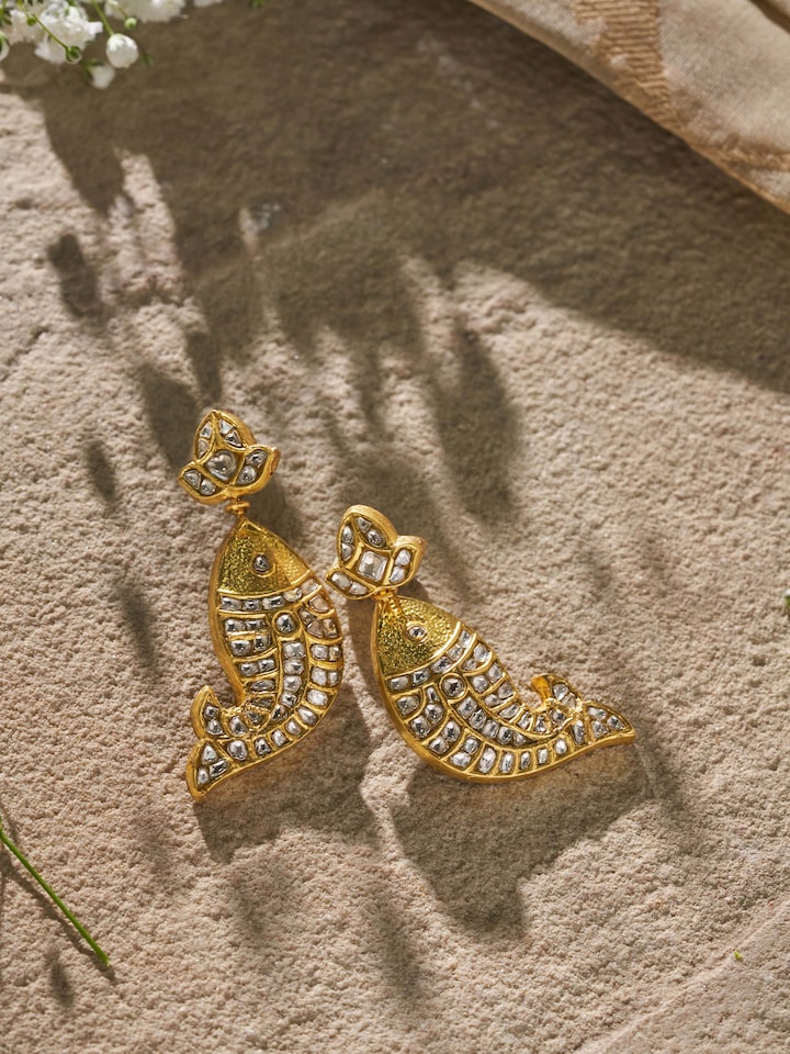Side view of Thappa 22 Karat Gold Drop Earrings highlighting detailed gold work and delicate drop design.